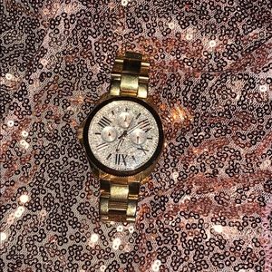 Women’s gold Fossil watch